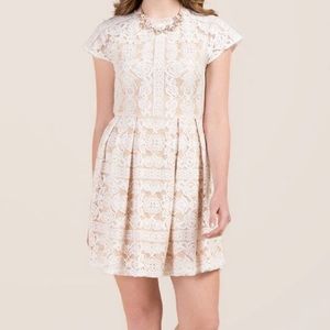 Francesca’s white open back lace dress